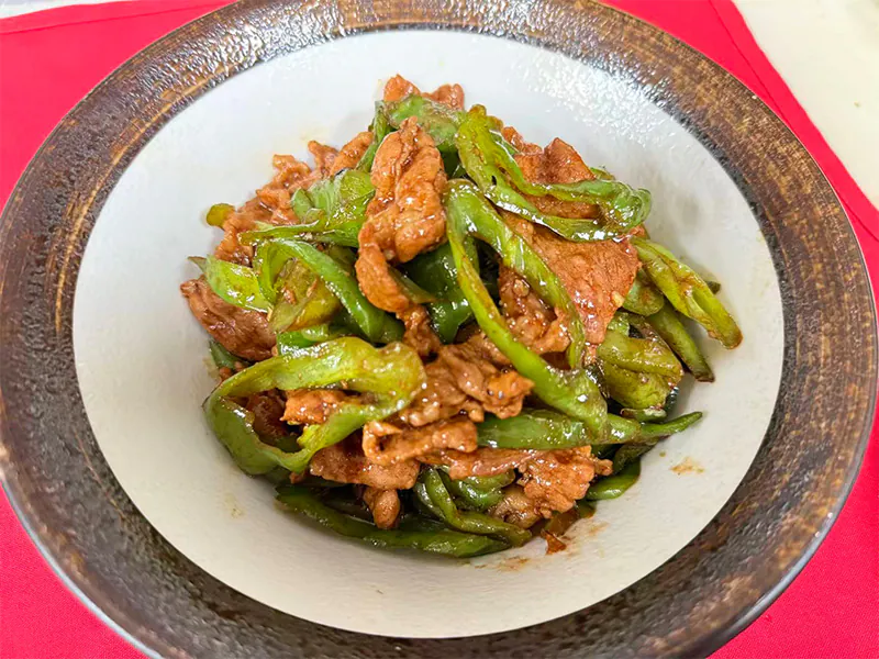 Savory stir-fried pork with fresh green chili peppers at Hunan Bistro (Dallas), a Chinese Restaurant in Plano