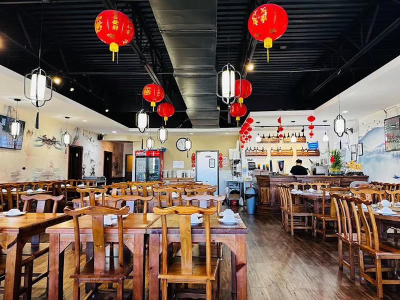 Warm, inviting dining room with traditional Chinese lanterns at Hunan Bistro (Dallas), a Chinese Restaurant in Plano